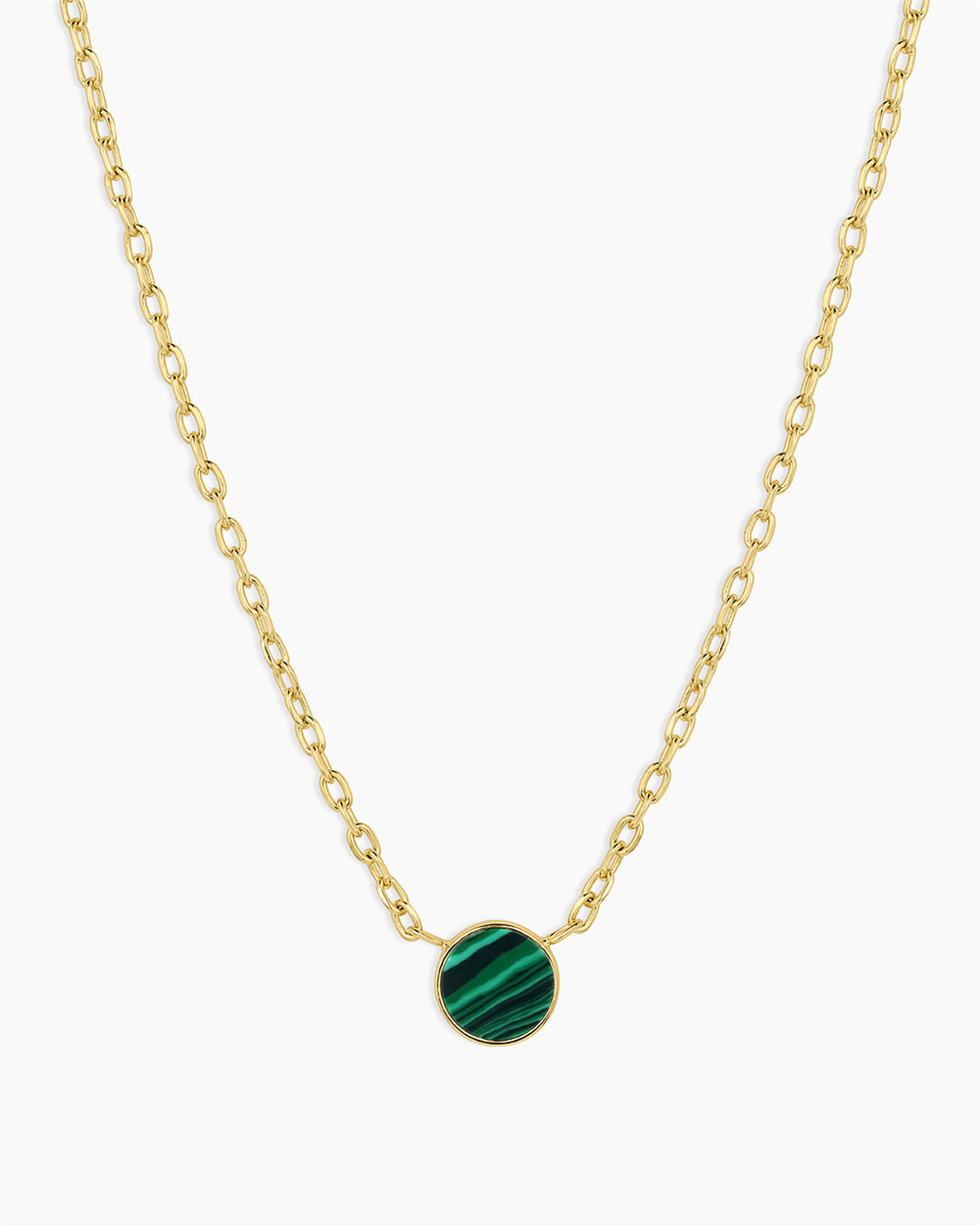The Gorjana Rose Marble Coin Necklace - Malachite features an 18k gold plated chain with a round green malachite pendant, showcasing subtle stripes and centered on the necklace.