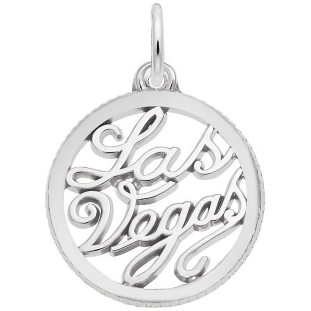 The Las Vegas Charm from Rembrandt Charms is a round sterling silver pendant featuring the words "Las Vegas" written in an intricate cursive script in the center. The connected letters create an elegant, openwork style, and it includes a small loop at the top for easy attachment to a chain.