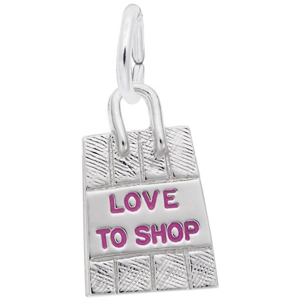The Rembrandt Charms Shopping Bag Charm features the text "LOVE TO SHOP" in pink letters on the front. This sterling silver piece has a loop at the top for attaching to a bracelet or necklace, and boasts a detailed texture resembling a woven pattern, making it an eye-catching accessory.