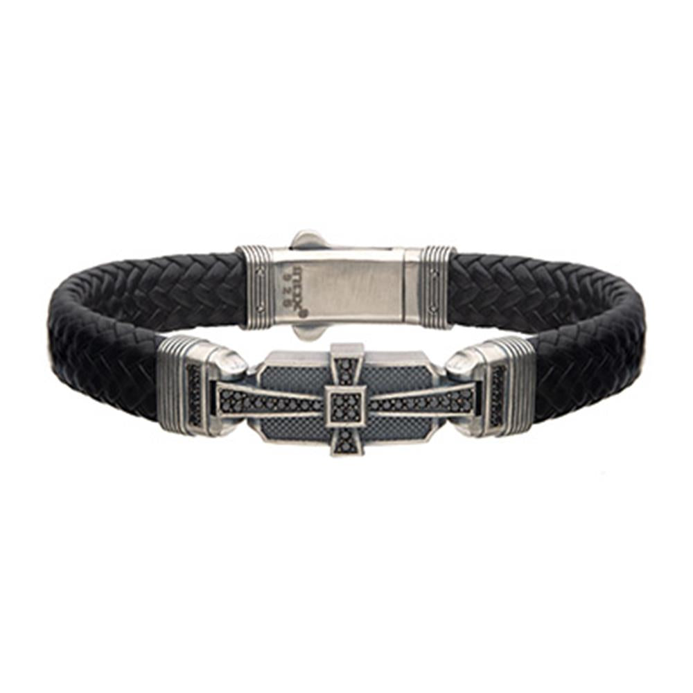 The INOX Men's Black Leather with 925 Silver and 40 pcs Black CZ Deco Bracelet boasts a black braided design, adorned with intricate 925 Silver accents and detailed cross at the center. Its sturdy clasp ensures a stylish yet rugged look, perfect for both casual and formal attire.