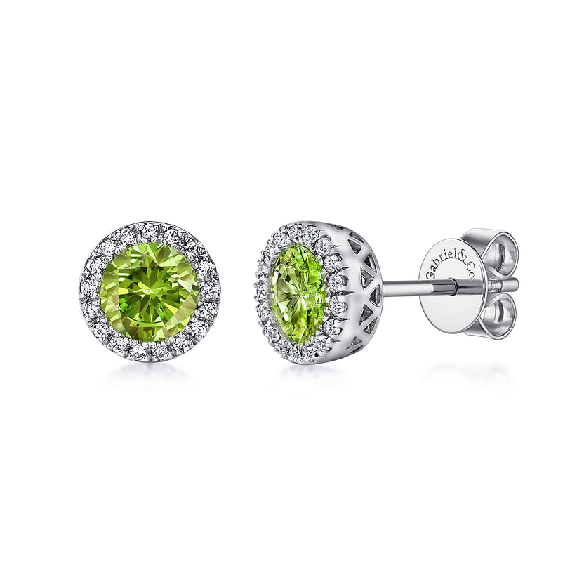 Gabriel & Co 14K white diamond and peridot studs feature round green peridot centers, a halo of small white diamonds, and butterfly backs.