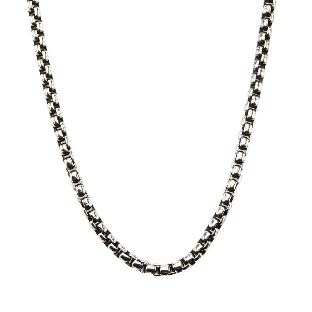 A close-up image of the Men's Stainless Steel Black Oxidized Bold Box Chain by INOX against a white background. The chain, designed for men, features square-shaped links and appears slightly curved at the bottom.