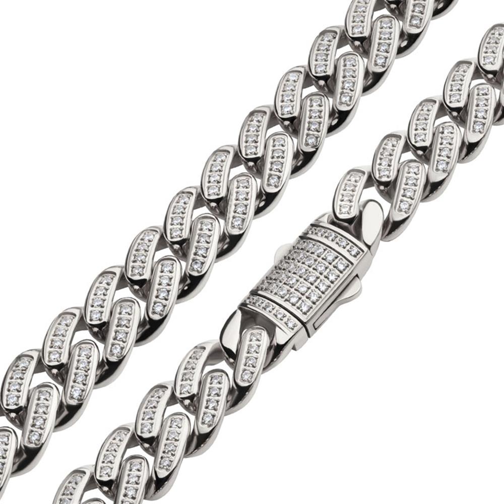 Close-up of a silver-toned 12mm Stainless Steel Miami Cuban Chain Necklace by INOX. It is adorned with sparkling cubic zirconia stones using CNC precision set technology. The clasp, also embellished with multiple stones, adds an elegant and luxurious touch to the piece.