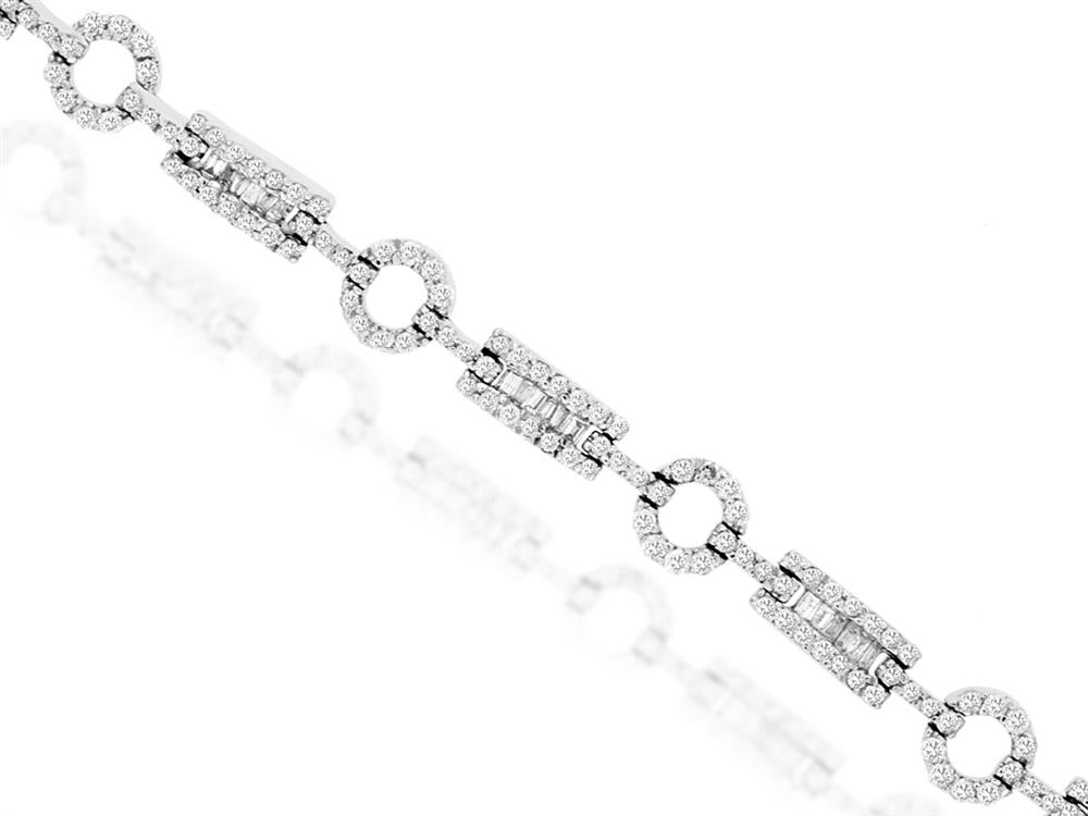 The Royal Jewelry 14K White Gold Baguette and Round Diamond Bracelet features 2.60 carats of round and baguette diamonds, elegantly set in alternating circular and rectangular links, creating a stunning contrast against the white gold backdrop.