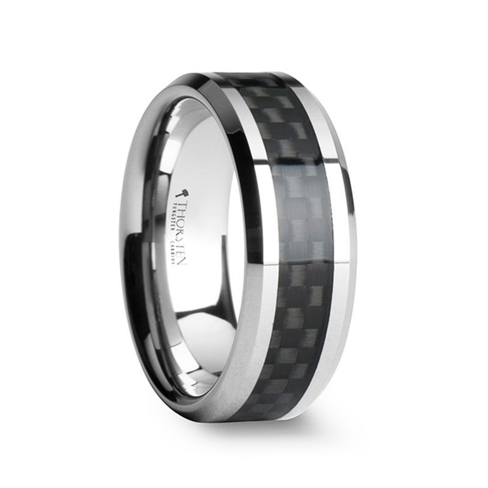 The Thorsten MAXIMUS Black Carbon Fiber Inlay Tungsten Carbide Wedding Band - 6mm is a silver wedding band featuring a woven black carbon fiber inlay that runs through the center of the tungsten carbide band. The ring has a polished finish, giving it a sleek and modern appearance. The interior of the band is also polished and bears an engraving.