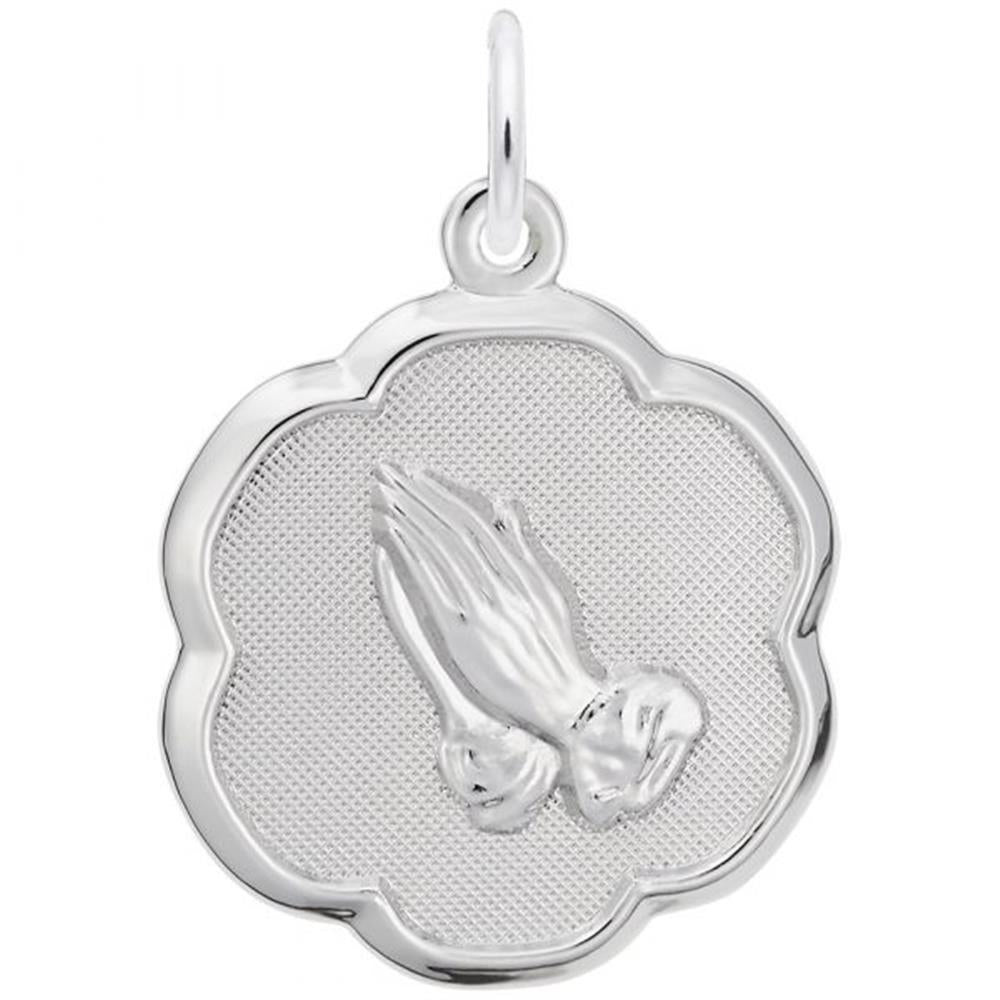 The Rembrandt Charms Praying Hands Charm in sterling silver showcases a pair of praying hands at the center, set against a textured background. The charm features a scalloped edge that creates a flower-like shape and includes a loop at the top for easy attachment to a chain or necklace.