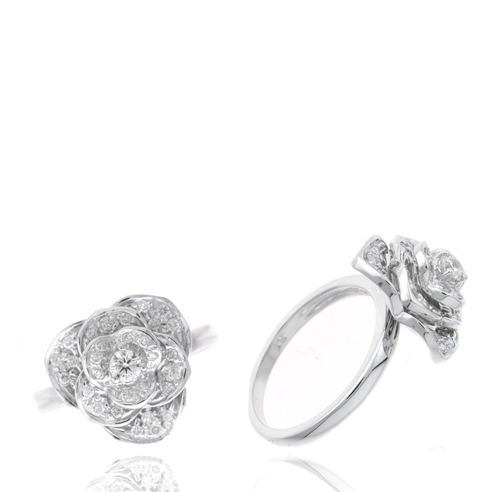 Two silver rings, RW12393D by Ryan Gems, crafted from white gold, showcase intricate floral designs with 0.30ct diamonds resembling blooming flowers. One ring is displayed from the top and the other from the side, highlighting their detailed craftsmanship.