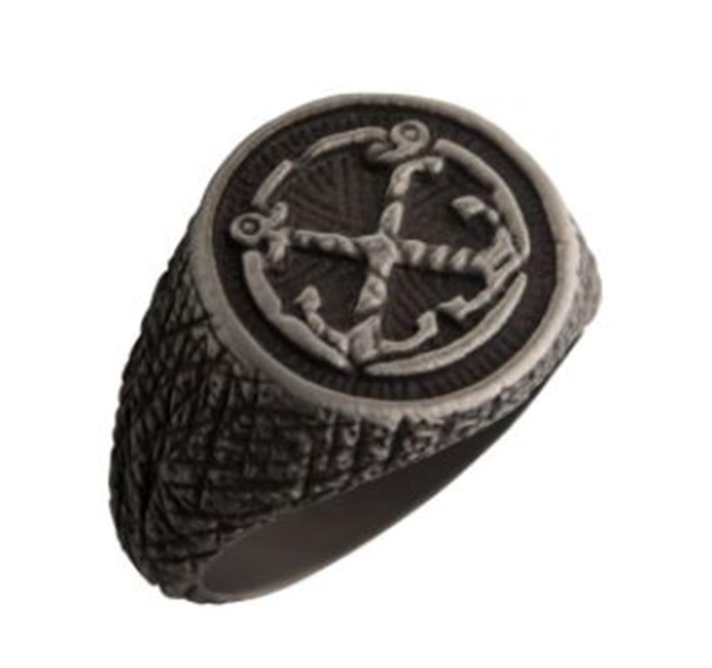 The Black Plated Antique Finish Steel Anchor Inlay Ring by INOX, size 10, showcases a textured dark band with a raised circular emblem featuring an antique nautical design. The top of the ring includes a black plated anchor encircled by rope-like detailing, while the sides are adorned with a rugged, crisscross pattern.