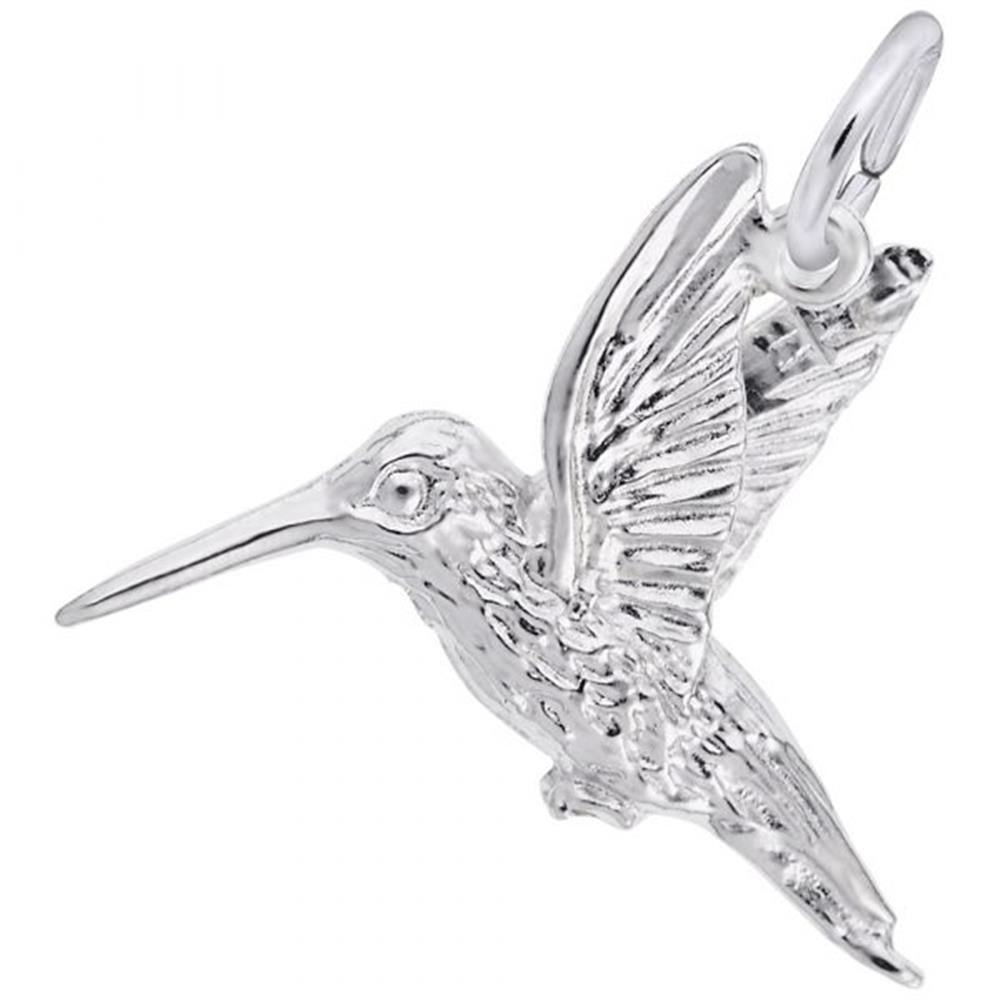 The Hummingbird Charm by Rembrandt Charms, crafted in sterling silver, features intricate detailing on the wings and body. Depicted mid-flight with an outstretched beak and wings flapping upward, it is attached to a small circular loop for adding to a necklace or bracelet.