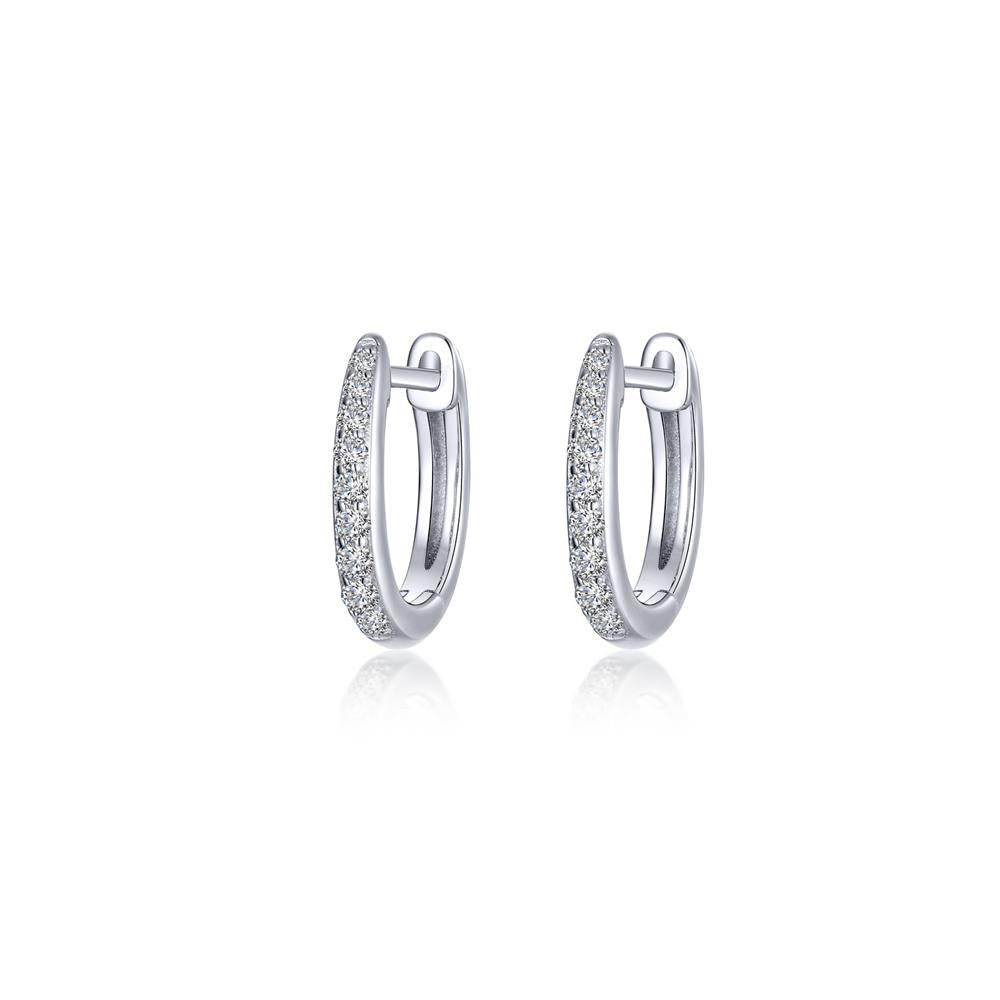 Lafonn's "Huggies" are elegant silver hoop earrings, encrusted with sparkling diamonds. These hoops delicately designed to catch the light add sophistication and are displayed on a plain white background.