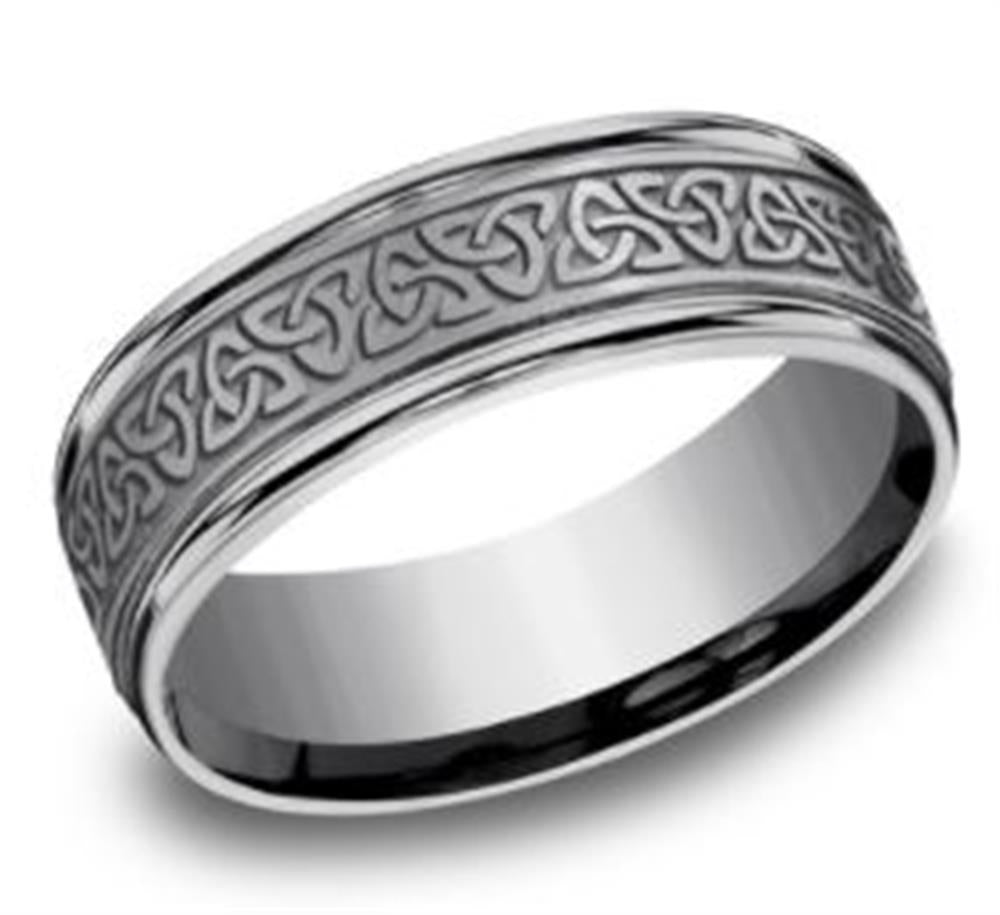 The 7mm Tantalum with Love Knot Triangle Designed Ring by Benchmark Rings features an intricate Celtic knot design around its band. The ring has a glossy finish, highlighting the detailed patterns on its surface, and exudes a unique and elegant appearance with its sophisticated love knot triangle motif.