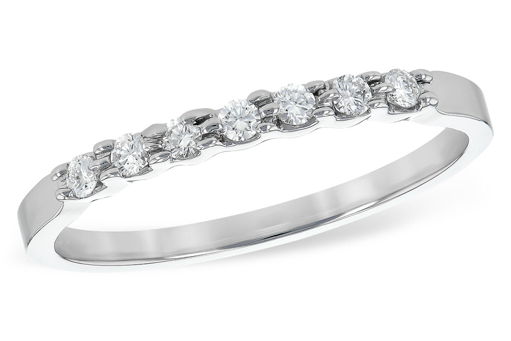 This image features a sleek silver or white gold band ring set with a row of round-cut diamonds. The diamonds are evenly spaced across the top of the band, creating a refined and elegant sparkle. The minimalistic design is timeless, making it a versatile piece for both daily wear and special occasions.