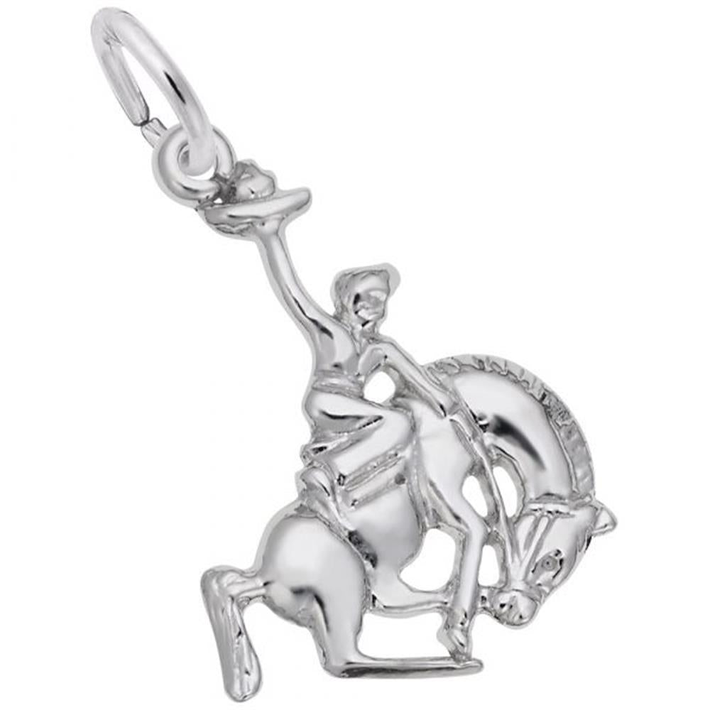 The Rembrandt Charms Horse And Cowboy Charm in sterling silver features a finely detailed cowboy riding a bucking horse, complete with one arm raised high holding a hat. This exquisite piece captures the dynamic motion of both the rider and the horse.