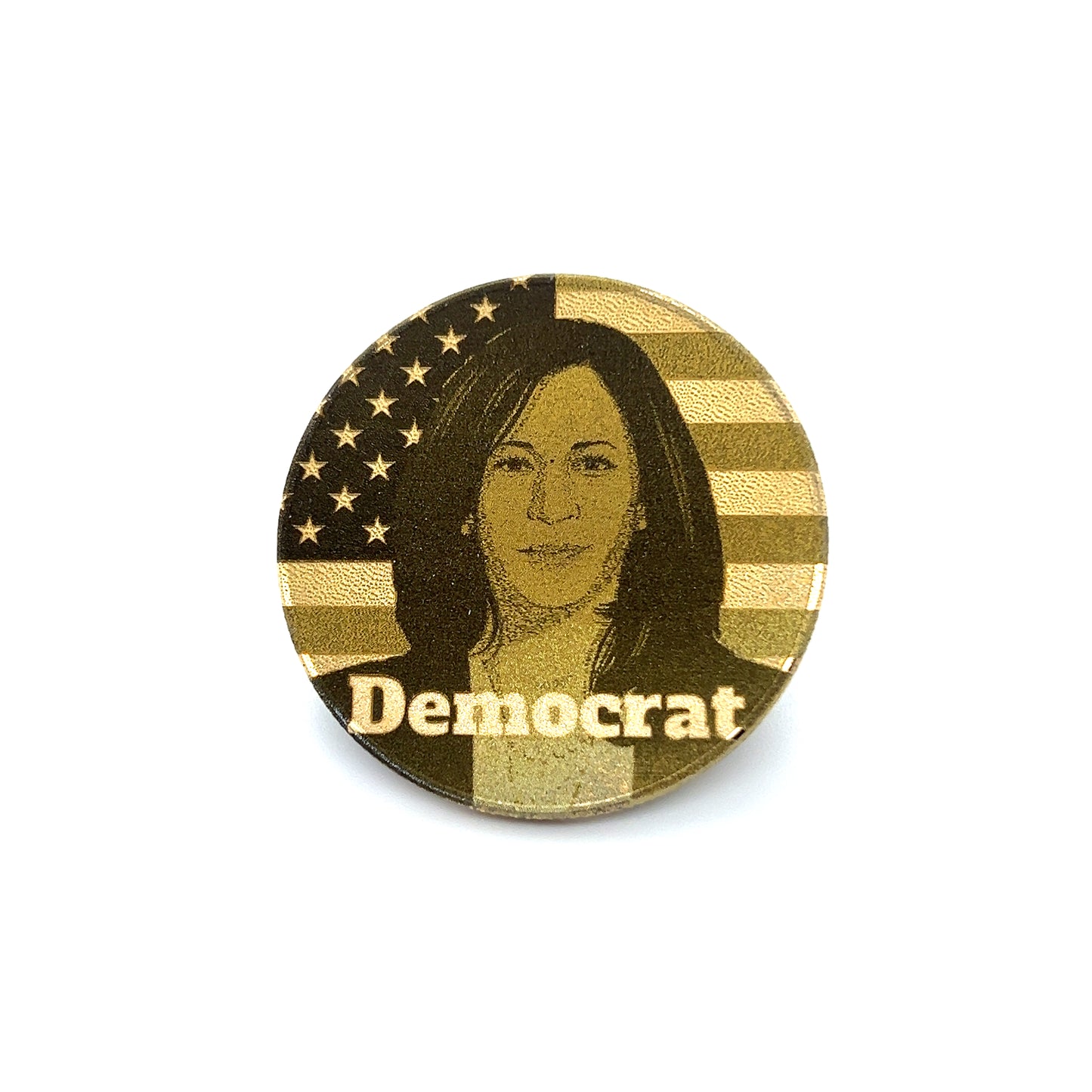 A round pin showcases a stylized portrait of a woman, vaguely resembling Kamala Harris, with the American flag superimposed. Beneath the portrait, in bold letters, is the word "Democrat," reflecting its connection to William Baxley & Avonlea Jewelers' 2024 Election Challenge Coin – Trump vs Kamala – Decision-Maker Flip Coin.
