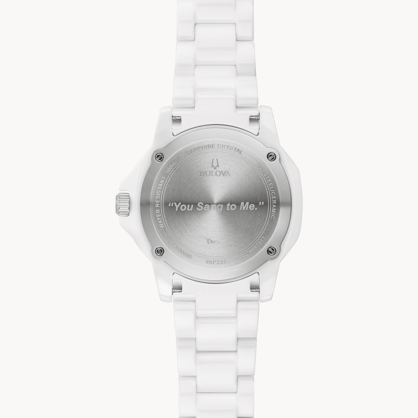 The back of a Bulova Marc Anthony Marine Star White Dial Women's Watch from Bulova Watch Company is engraved with “You Sang to Me,” along with branding details and specifications on the edge of the case back.