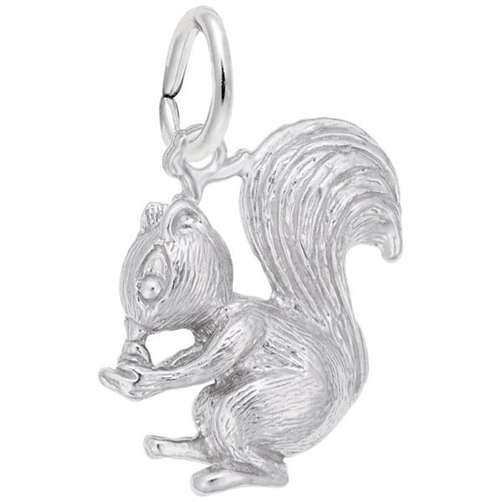 The Squirrel Charm in sterling silver from the Rembrandt Charms collection showcases a meticulously designed squirrel sitting while clutching a nut in its front paws. The charm features detailed fur texture, a prominent bushy tail, and includes a small loop at the top for easy attachment.