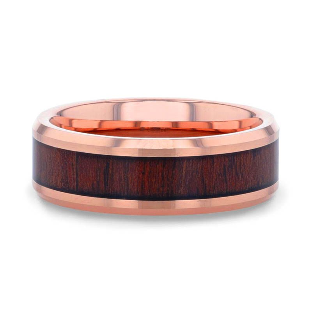 The DYLAN Rose Gold Plated Koa Wood Inlaid Tungsten Men's Wedding Band by Thorsten showcases a sophisticated design, featuring a polished rose gold finish and a striking Koa wood inlay encircling the band. The contrast between the warm wood tones and the sleek metallic sheen of the rose gold results in an elegant, modern aesthetic.