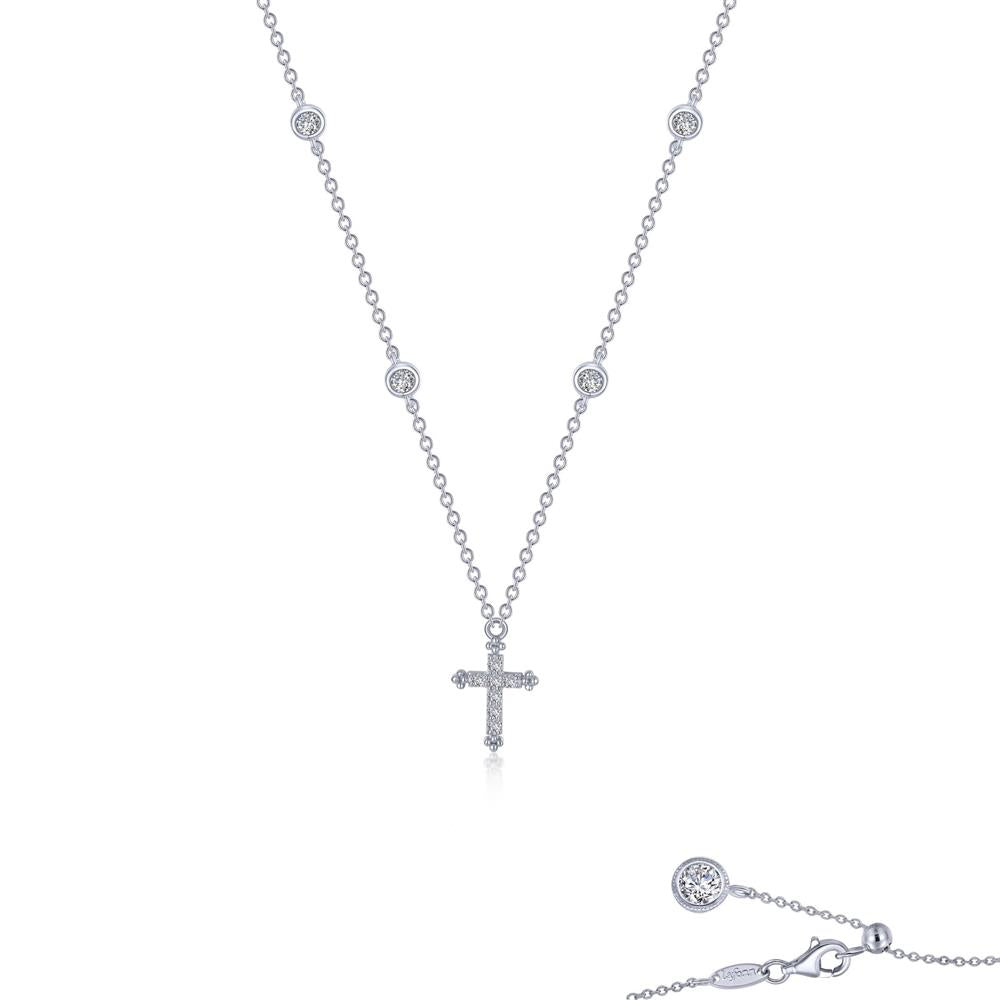 Introducing the Cross Necklace by Lafonn, a stunning piece of jewelry crafted from delicate Sterling silver. This elegant necklace features a small, sparkling cross pendant and boasts evenly spaced, clear simulated diamonds along the chain. It is completed with a sophisticated lobster claw clasp and an extender adorned with additional gemstone detailing.