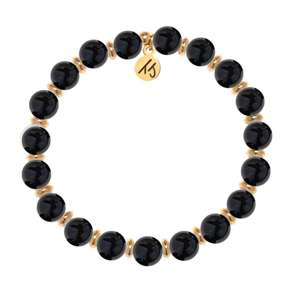 The T Jazelle Gold Empowered Elegance Collection- Onyx Gemstone Bracelet features alternating shiny black onyx beads, gold spacers, and a round gold charm engraved with "15.