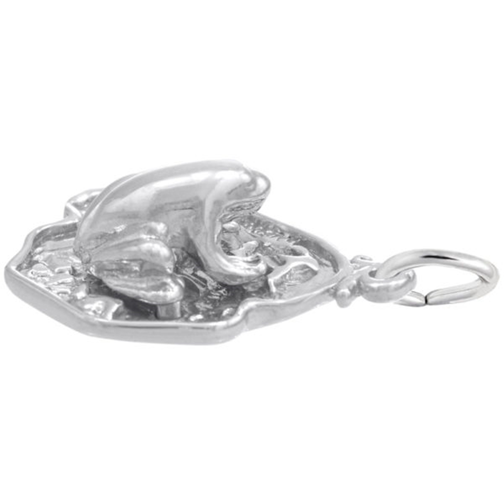 The "frog on lily pad" Sterling Silver Charm by Rembrandt Charms showcases a highly detailed, shiny 3D design of a frog on a lily pad. It features a small loop for easy attachment to bracelets or necklaces.