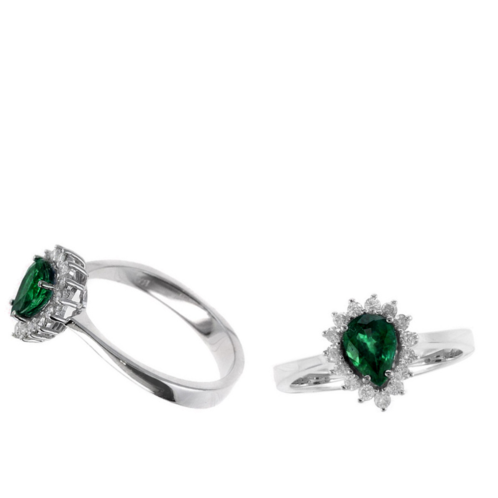 Set against a white background, the RW11040E rings from Ryan Gems feature 0.70ct pear-shaped emeralds encircled by 0.22ct diamond-like stones in white gold, displayed at varying angles for an enchanting view.