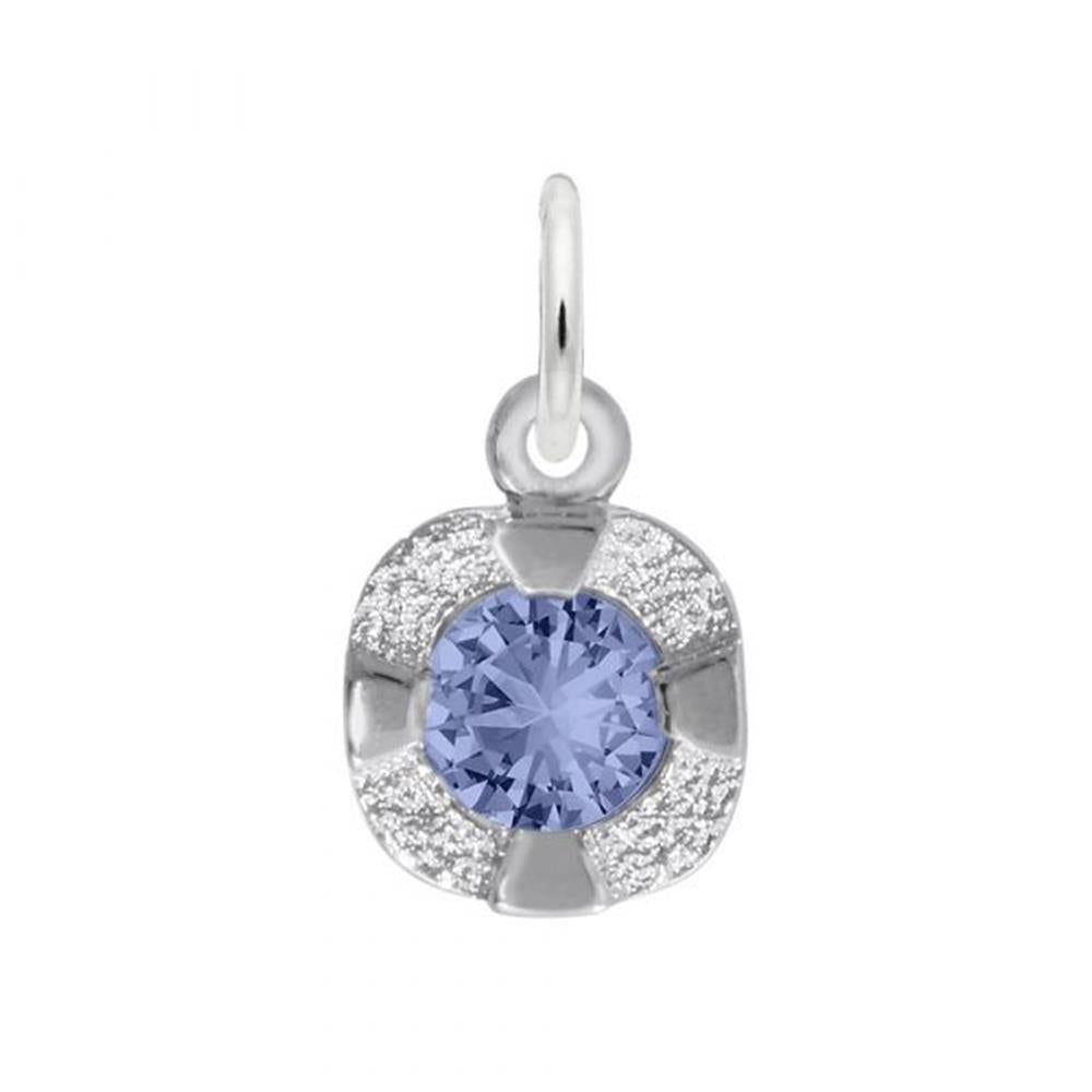 A touch of elegance is effortlessly added to any ensemble with the Petite Birthstone – September Charm from Rembrandt Charms. This sterling silver pendant features a small hoop at the top, showcasing a central round blue gemstone held securely by four silver prongs. The backdrop is adorned with shimmering, textured silver accents, enhancing the charm's refined beauty.