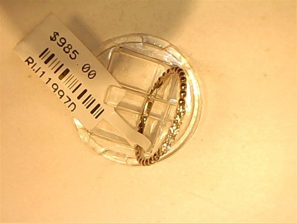 A Small Dainty Diamond band by Ryan Gems, crafted in 14k white gold (size 6.75), is shown on a clear stand with a $985 price tag and barcode RU119970 against a light background.
