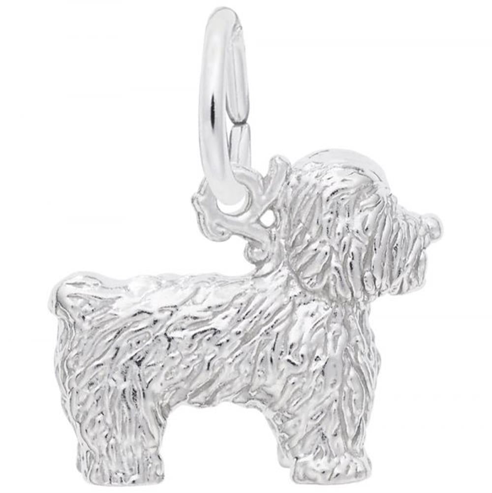 The Rembrandt Charms Bichon Frise Dog Charm, crafted from sterling silver, features a detailed fur texture reminiscent of a shaggy dog. It includes a small, circular hoop at the top for easy attachment to a chain or bracelet.