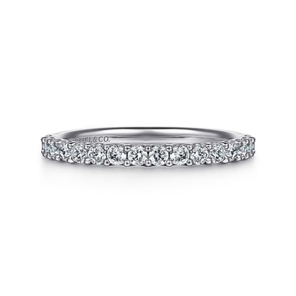 The Gabriel & Co 14k white gold shared prong set diamond wedding band, serial no S205, features a delicate row of sparkling round diamonds for an elegant and understated design.