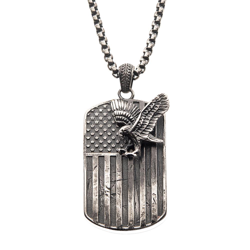 The Gun Metal Plated Rugged American Flag with a Polished Steel 3D Eagle Pendant on a Box Chain by INOX is a striking men's necklace perfect for any occasion. Featuring a rectangular dog tag design, the pendant showcases an American flag with a three-dimensional eagle perched on the stars and wings outstretched. The chain comprises small, interlocking square links, adding to its bold and distinctive look.