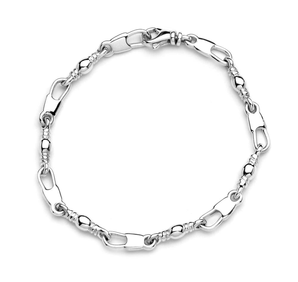 The Fisher of Men bracelet by Denali Pro Jewelers features a delicate silver design with an alternating pattern of shiny, elongated oval links and smaller, intricate looped links, creating a stylish and elegant look. The 7.75" long bracelet is secured with a Snap Swivel lobster clasp for easy wear.