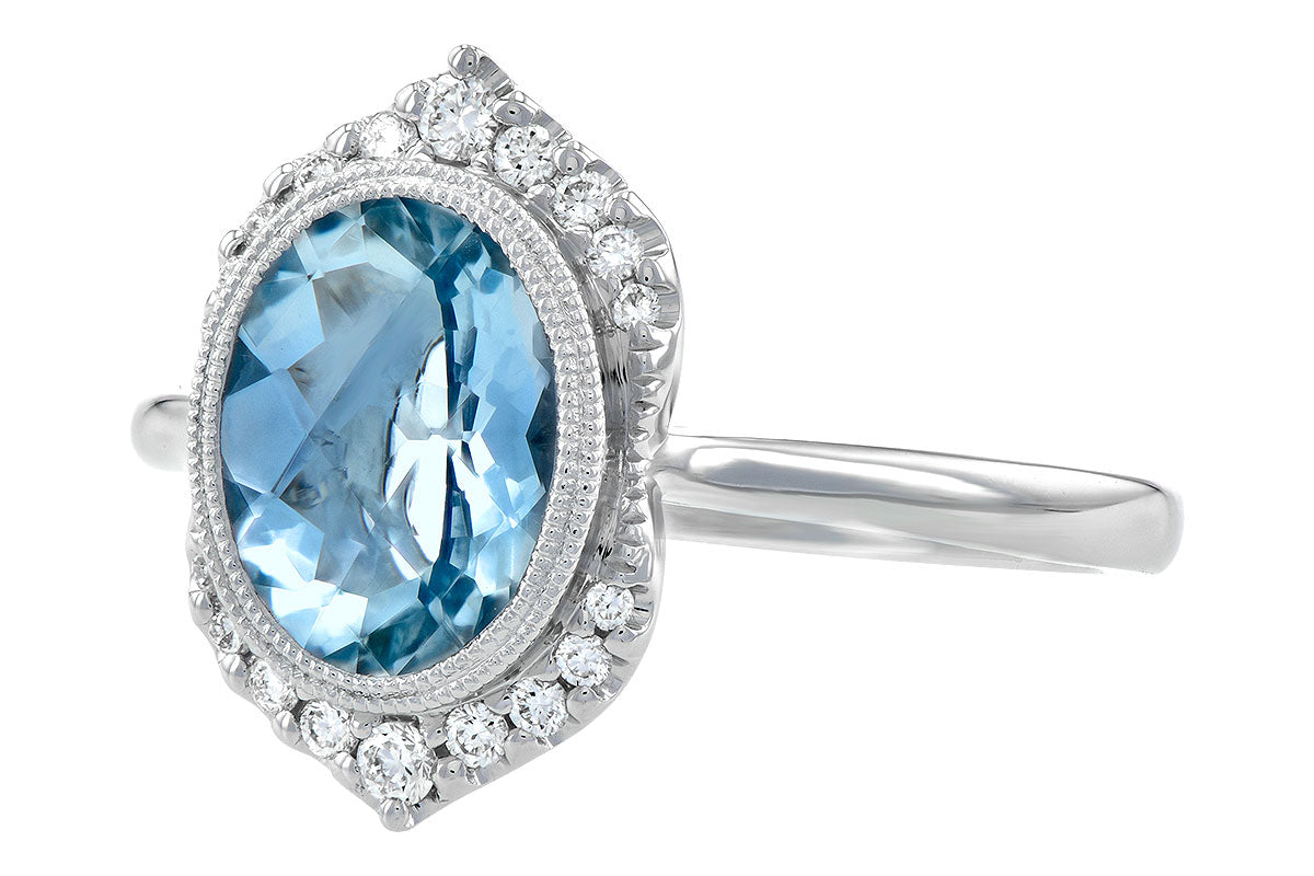 An Aquamarine and Diamond 14k White Gold Ring from Allison Kaufman features an oval-cut blue gemstone encircled by a dazzling halo of small, round diamonds. The sleek white gold band enhances the gemstone's vibrant hue and the brilliance of the surrounding stones.