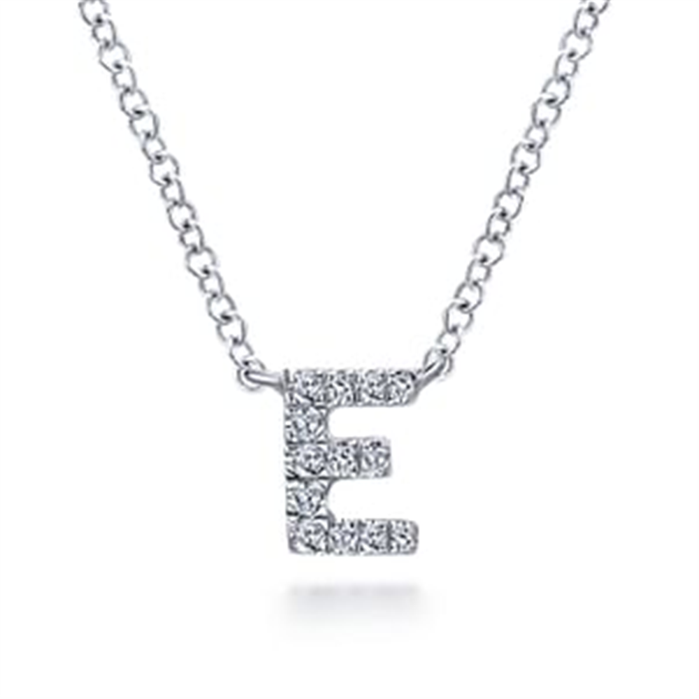 The Gabriel & Co E pendant w diamond is a silver necklace featuring an elegant "E" adorned with sparkling stones, making it a standout piece of jewelry.