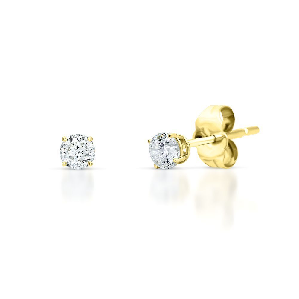 Introducing the Round Natural Diamond Stud Earrings by Simply Diamonds: a stunning pair of gold stud earrings showcasing handpicked round-cut natural diamonds. One earring is displayed front-facing, highlighting the brilliant diamond, while the other is side-facing to emphasize the elegant gold post and butterfly back. The white background enhances the earrings' radiant shine perfectly.