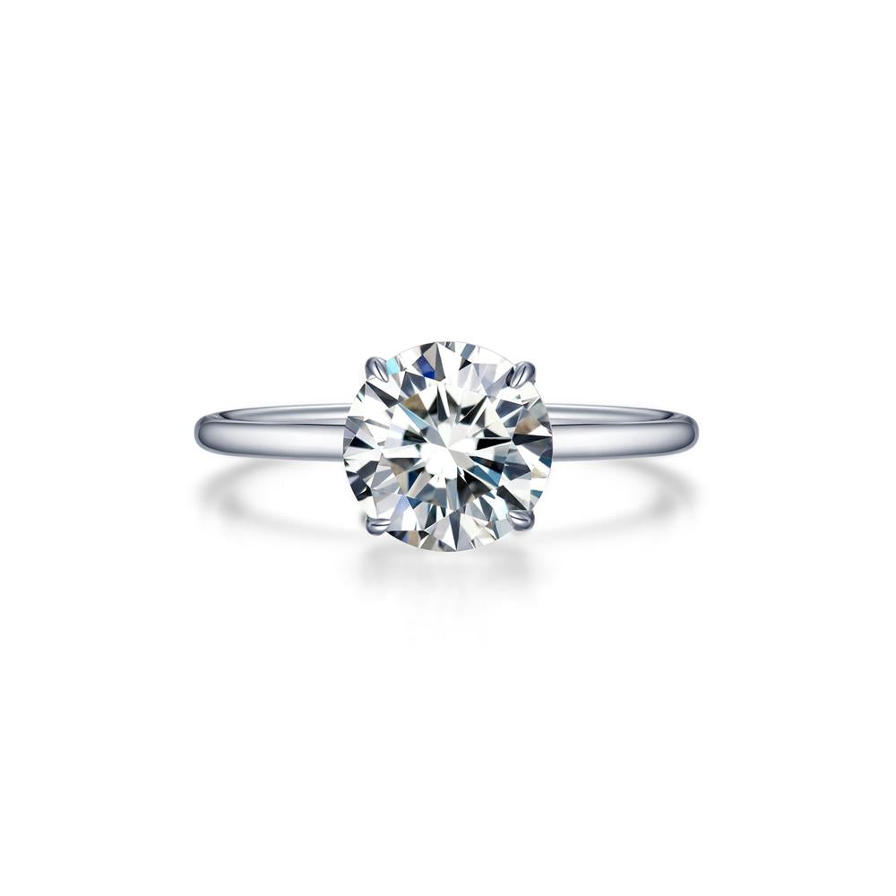 The Lafonn Solitaire Engagement Ring 2.0 ctw Round Size 7 showcases a stunning, minimalist design with a 2.0 carat total weight, round-cut diamond set in a sleek white metal band. The gem is securely held by four prongs, and the delicate size 7 band enhances the diamond's brilliance against a plain white backdrop.