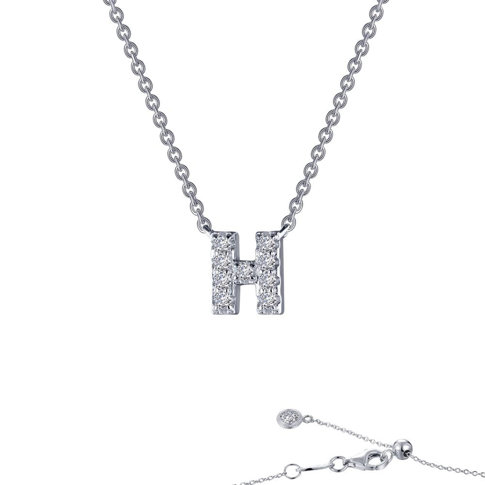 The Letter H Pendant Necklace from Lafonn is a stunning piece of jewelry. It showcases a pendant shaped like the letter "H," adorned with small, sparkling crystals. The fine and delicate chain ends with a clasp and an adjustable segment featuring a small crystal charm at the end.