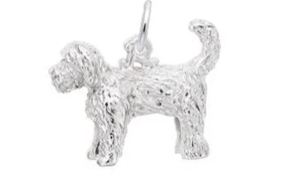 The Goldendoodle Dog Charm from Rembrandt Charms is crafted from sterling silver and intricately designed to capture the detailed fur texture of a Goldendoodle. This charm depicts the dog standing with its tail curved upward, exuding true canine cuteness. A small loop is attached to the dog's back, making it easy to add to a bracelet or necklace.