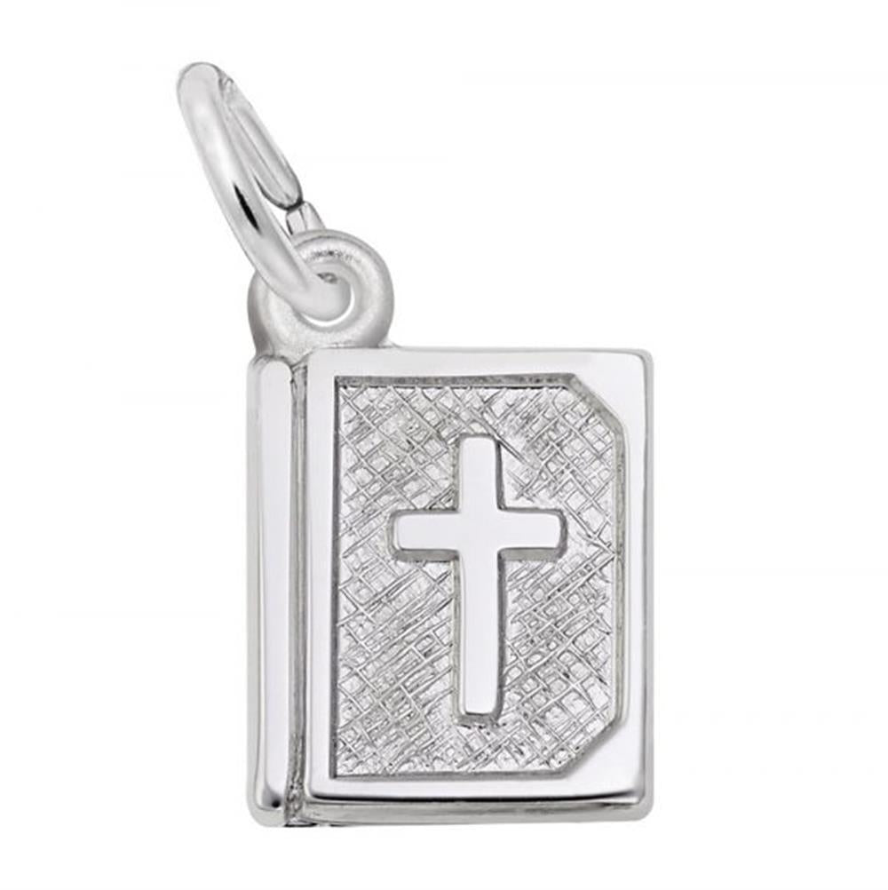 The Rembrandt Charms Bible Charm is a sterling silver pendant shaped like a book, featuring an engraved cross on its cover. This charm includes a loop at the top for attaching to a chain and displays textured detailing around the cross.