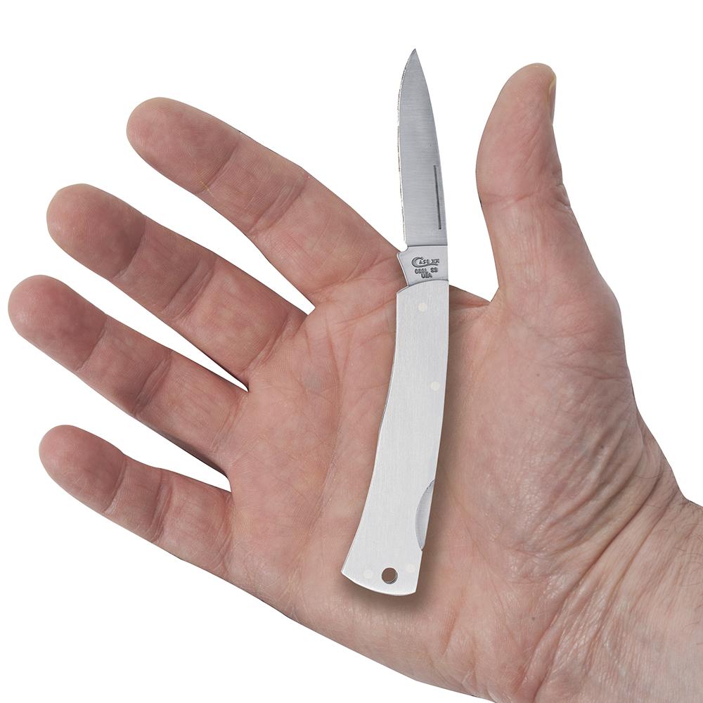 A hand holding a small, folded, Brushed Stainless Steel Executive Lockback with a sharp stainless steel blade exposed. The knife from W.R. Case & Sons Cutlery Co. has a minimalist design with a smooth handle and a slight curve near the base. The palm of the hand is open, displaying the knife's size relative to the palm.