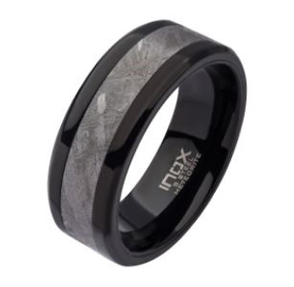 The Men's Meteorite Inlay Black Plated Ring by INOX features a central silver-gray meteorite inlay with a distinct pattern. The smooth polish of the inner band contrasts beautifully with the textured inlay, creating a striking appearance. The interior of this exceptional size 10 ring has the text "INOX" inscribed.