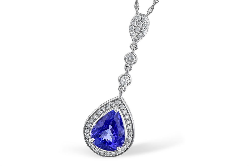 This Tanzanite and Diamonds 14K white gold necklace by Allison Kaufman features a teardrop-shaped blue gemstone pendant highlighted with diamond accents. The pendant is beautifully attached to a delicate chain adorned with additional round diamonds, enhancing its sophisticated appeal.