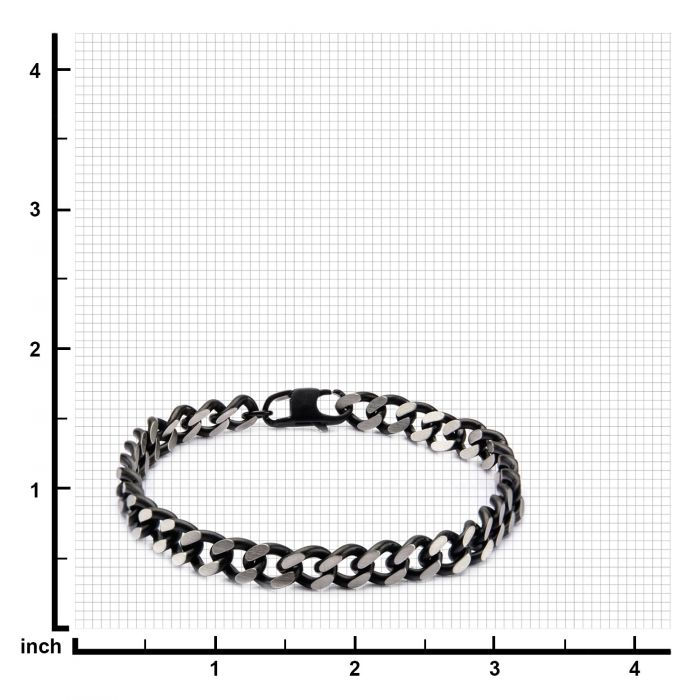 The Black IP Diamond Cut Chain Bracelet by INOX is displayed on a grid background with each square representing one inch. The men's bracelet, laid flat in a circular shape, features a clasp closure and the black and silver design is highlighted against the measurements in inches to indicate its size.
