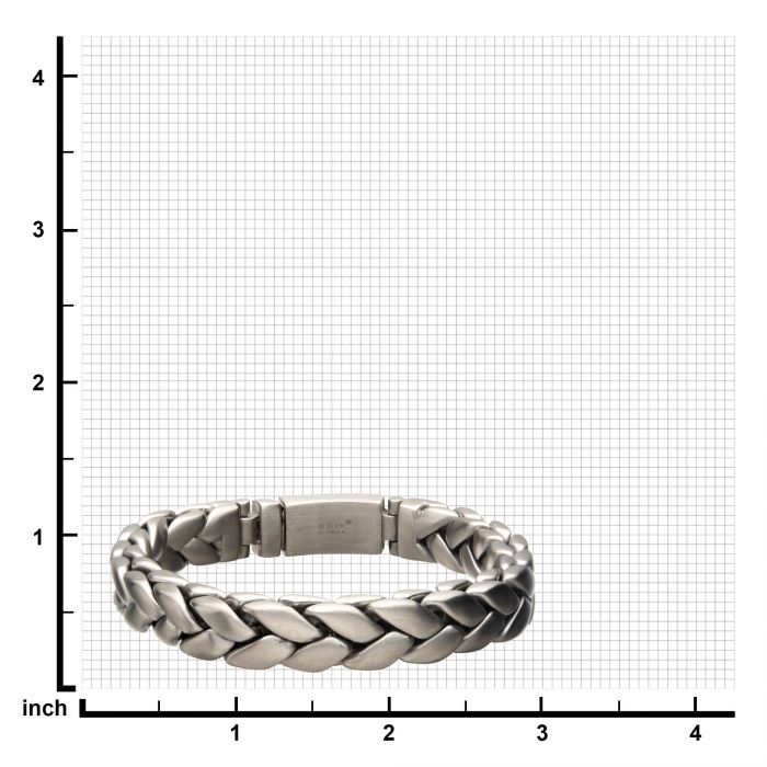 The Matte Stainless Steel Big Double Spiga Chain Bracelet by INOX, featuring a silver matte finish and an intricate double Spiga chain design, is placed on graph paper with a grid marked in inches. The bracelet spans approximately from 1.2 to 3.5 inches horizontally and from 1 to 2 inches vertically.