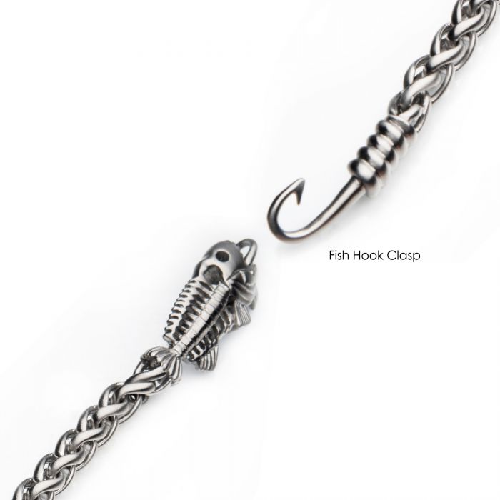 Introducing the Polished Steel Wheat Chain with Fishbone on Hook Clasp Bracelet by INOX: a stainless steel men's bracelet featuring a unique clasp design. One end is shaped like a fish skeleton, and the other resembles a fish hook. The textured wheat chain adds an extra layer of sophistication, while the fish hook securely inserts into the fish skeleton. The text "Fish Hook Clasp" is elegantly displayed near the hook for added detail.