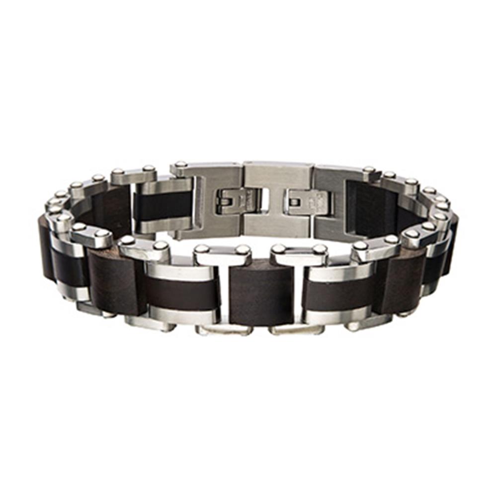 Introducing the Men's Stainless Steel with Ebony Bracelet by INOX, a modern piece featuring a series of rectangular black and silver links. The design incorporates alternating colors to create a sleek, geometric pattern and includes a secure clasp closure. This bold, contemporary bracelet is also self-adjustable for an optimal fit.