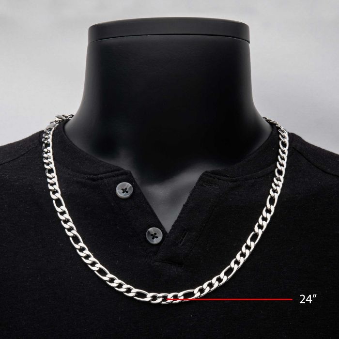 An 8mm Steel Figaro Chain from INOX, measuring 20 inches in length, is displayed on a black mannequin torso dressed in a black buttoned shirt. The length of the men's necklace is indicated by a red line with the measurement "20"".