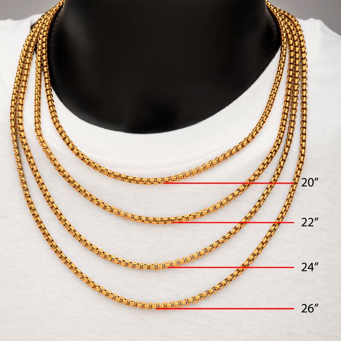 A close-up image of a person wearing a white shirt and four 18K gold plated chain necklaces of different lengths around their neck. The chains, including the INOX 4mm 18K Gold Plated Bold Box Chain Necklace, are labeled with red text indicating the lengths: 20 inches, 22 inches (INOX), 24 inches, and 26 inches from top to bottom.