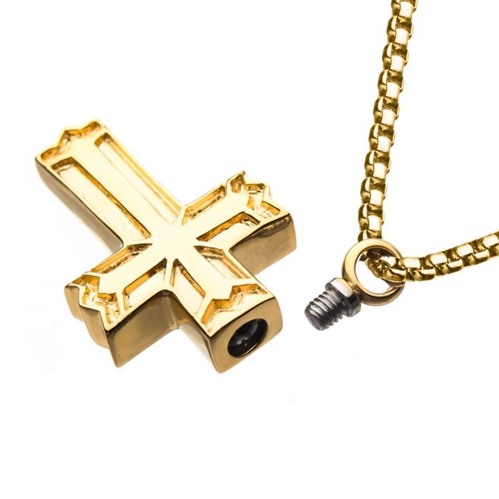 The INOX Stainless Steel Gold Plated Stash Cross Pendant, featuring an intricate design detail, is shown alongside a men's stainless steel box chain equipped with an open screw clasp for secure attachment. The hollow space within the pendant hints at its potential use as a keepsake or cremation urn. Both pieces gleam strikingly against a white background.
