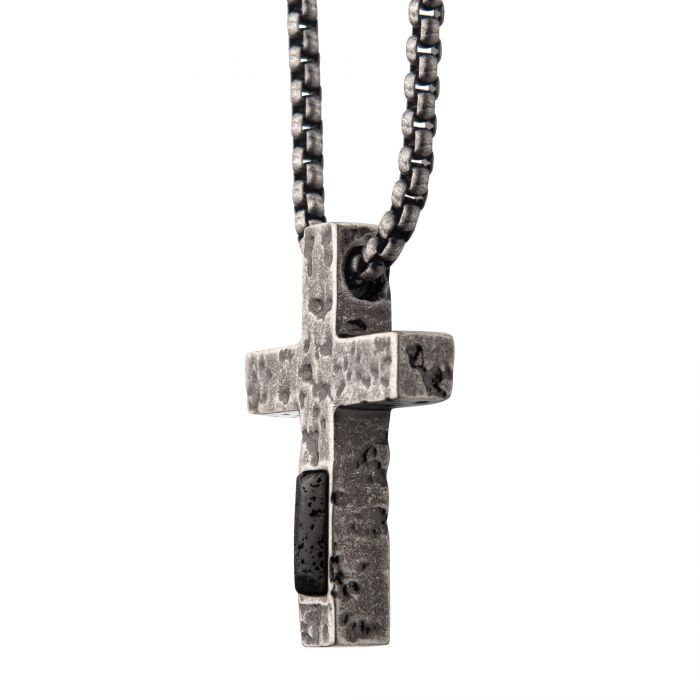 The INOX Stainless Steel Silver Plated Cross Pendant with Lava Stone Pendant features a rugged silver cross with a textured surface, suspended from a chunky, rectangular-link steel box chain. The cross pendant includes a dark lava stone inset on its right side, adding a contrasting detail to its design—an ideal addition to any men's jewelry collection.