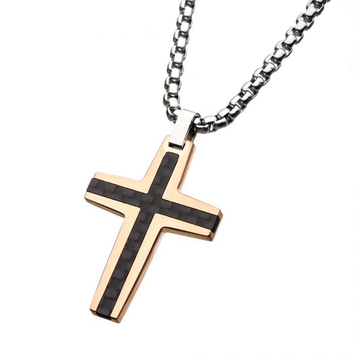 The INOX Black and Rose Gold Plated with Carbon Fiber Link Inlay Cross Pendant features a sleek and modern design, complete with a textured black stripe running vertically and horizontally across its center. Hanging from a thick steel chain, this men's pendant combines black and rose gold plating to create an eye-catching piece.